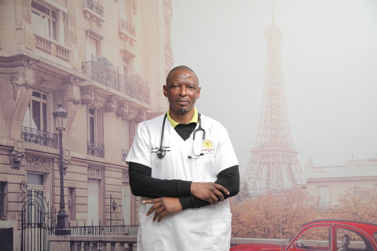 Dr Sam Tjangase consulting a patient at Sampax Health 911